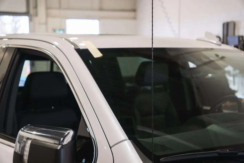 Close-up view of a freshly installed windshield at Windshield Surgeons Auto Glass