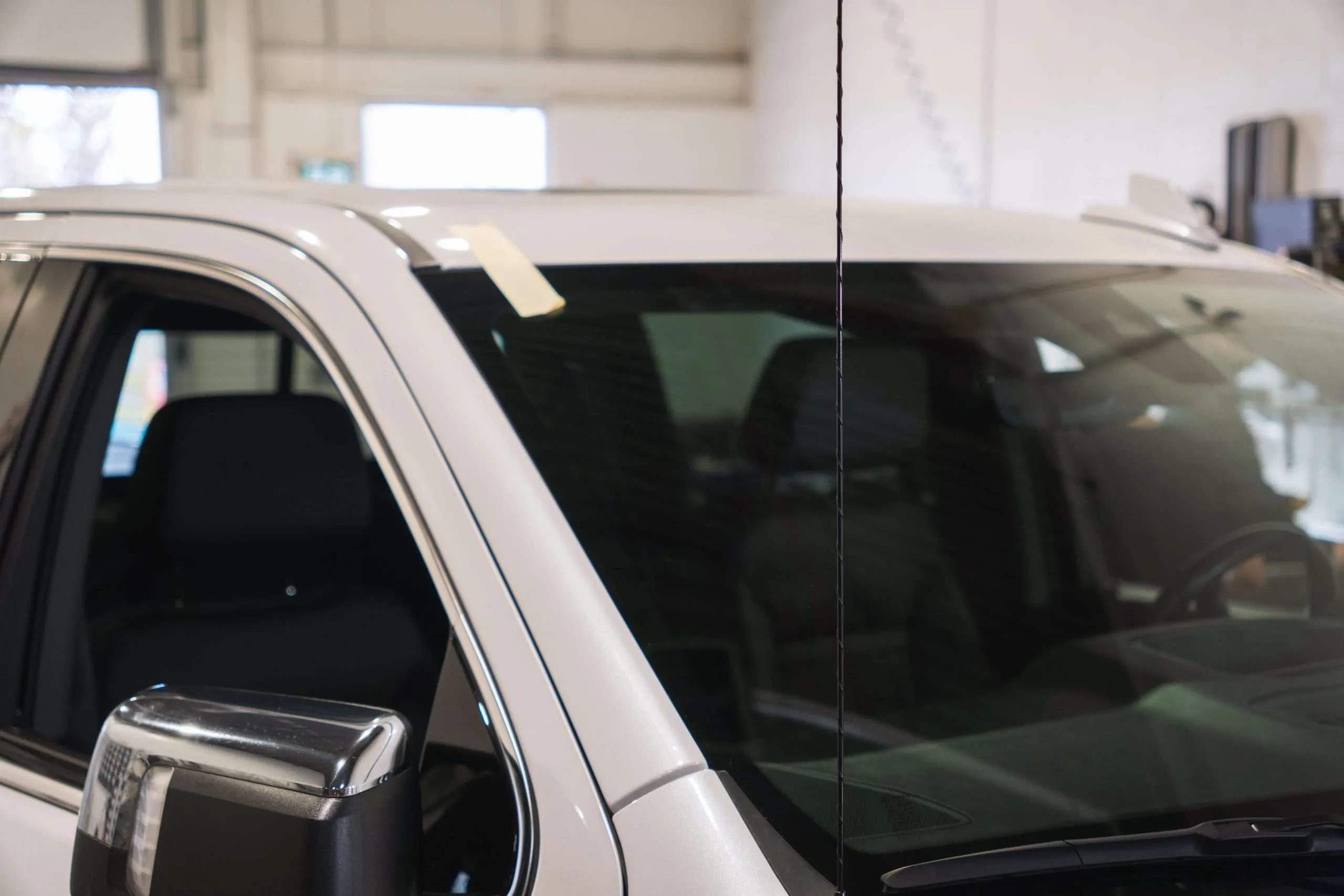 Close-up view of a freshly installed windshield at Windshield Surgeons Auto Glass