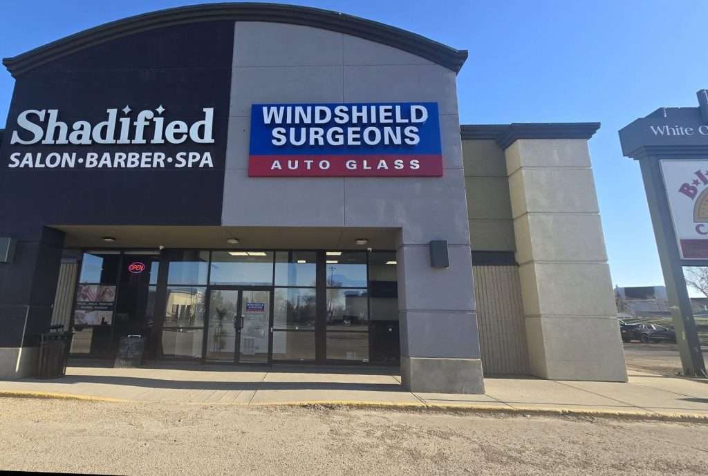 Exterior view of the Edmonton North Windshield Surgeons Auto Glass shop. Front of the location showing windshield sign and building facade.